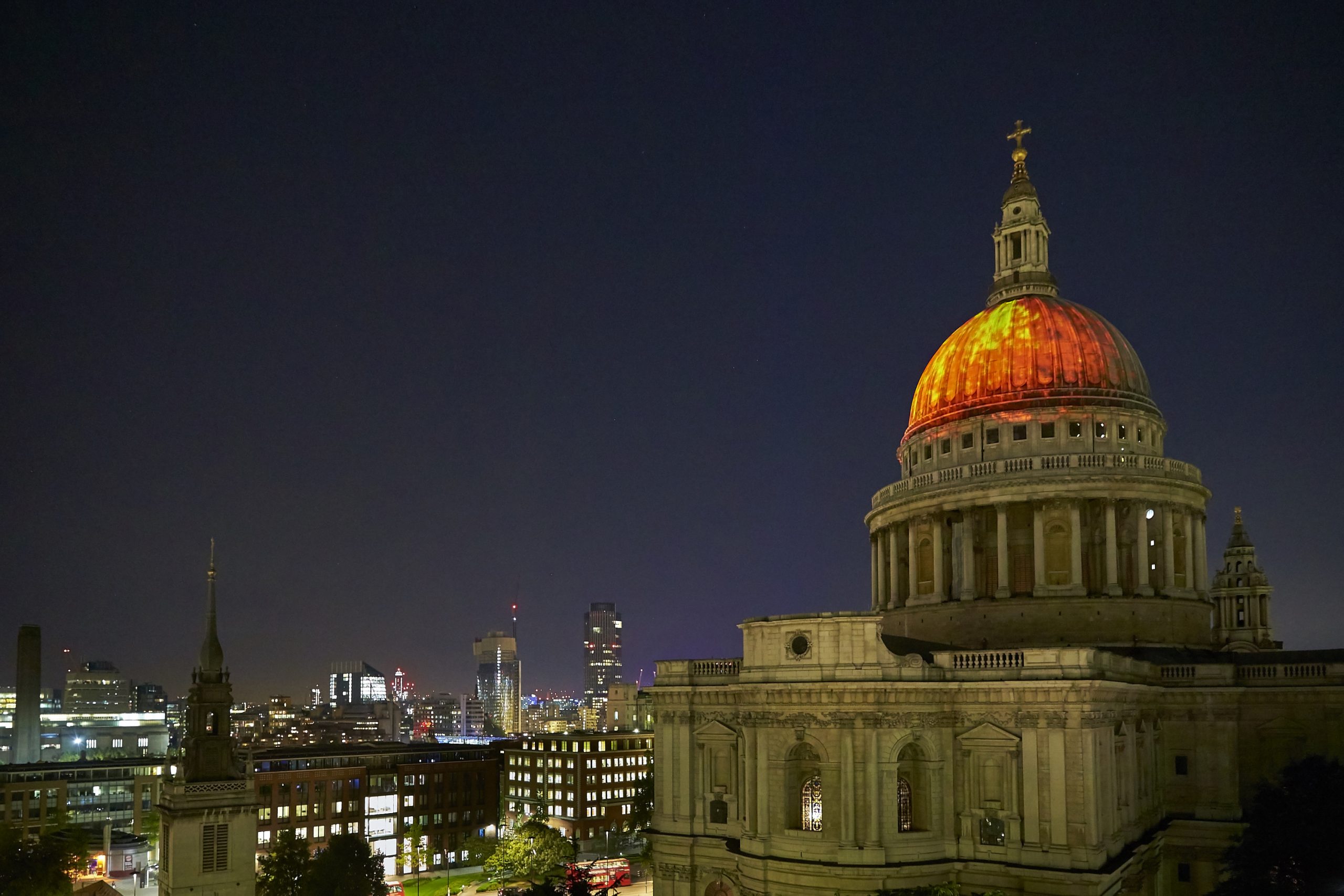 Imagery of flames projected onto the roof of St Pauls Cathedral