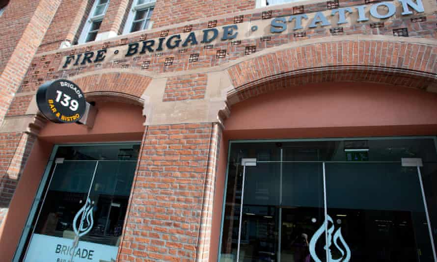 Close-up of the arched doorway of a red brick building- Brigade Bar and Bistro in The Fire Station