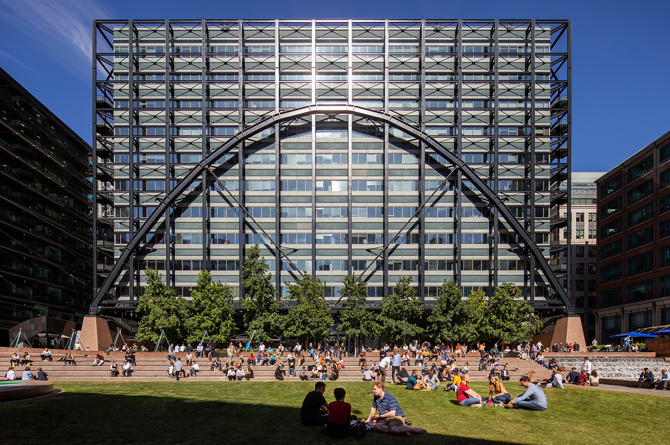 Exchange House, Broadgate. A grassy area in front of a large modern building black