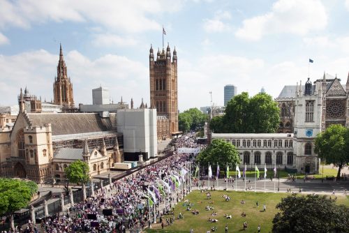 PROCESSIONS crowds in white, violet and green against the backdrop of Westminster in London.