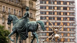 A giant mechanical Spider climbing a building in Liverpool