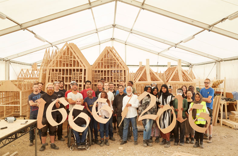 London 1666 participants and artist David Best holding up wooden numbers which say 