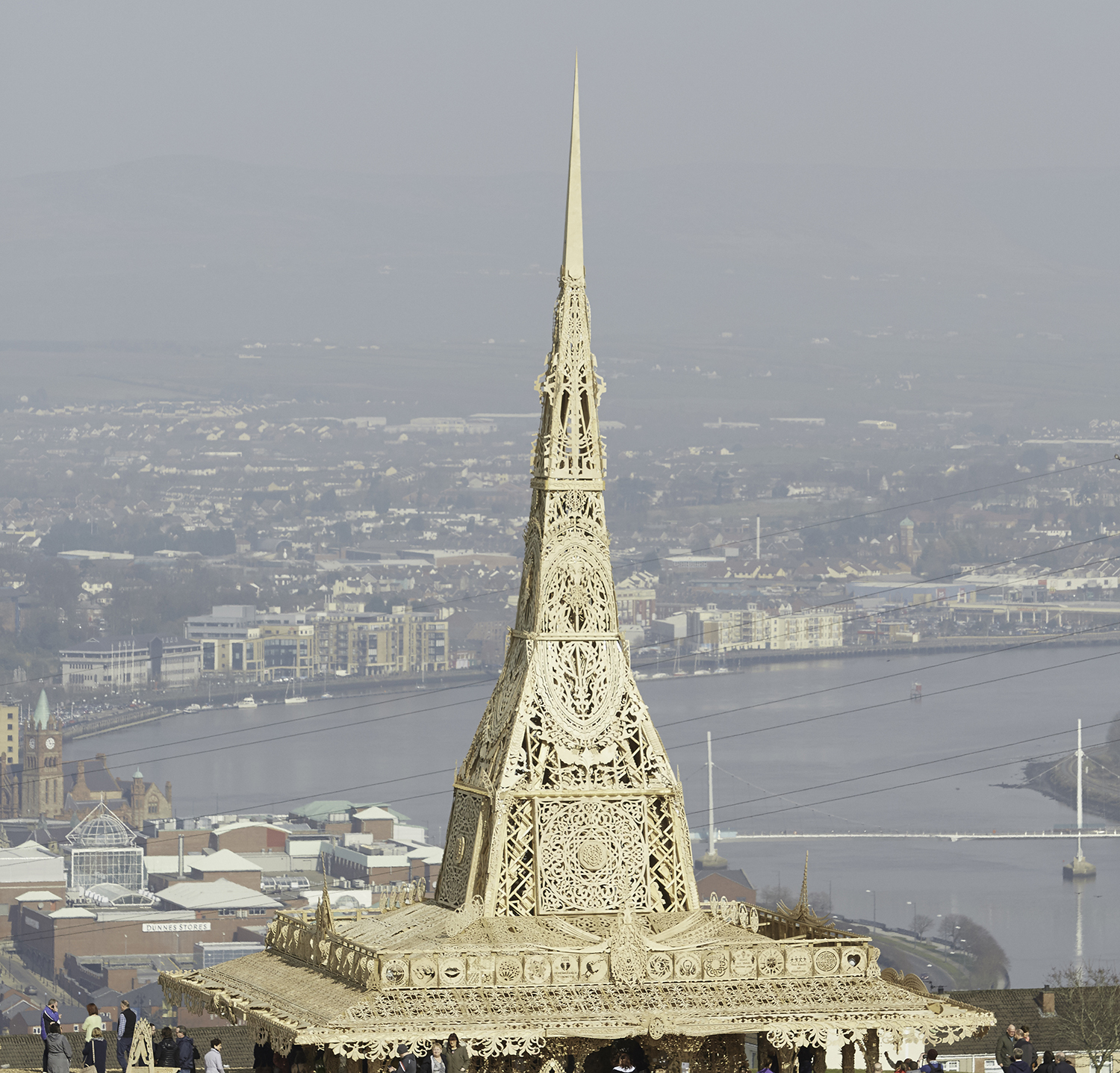 Top of temple in the day on a hill with Derry~Londonderry visible in the background