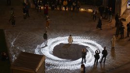 Light installation Hidden Voices: PROCESSIONS in the City at night in Aldgate Square