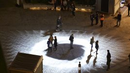 Light installation Hidden Voices: PROCESSIONS in the City at night in Aldgate Square