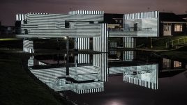 Apollo Pavilion illuminated in striped monochrome light.