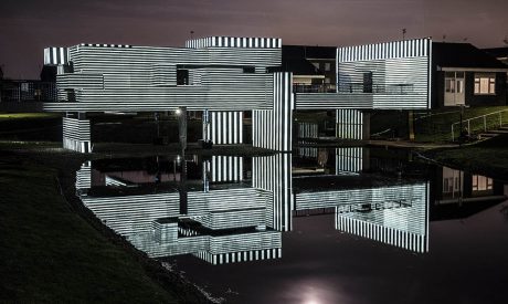 Geometric structure illuminated in monochrome light.