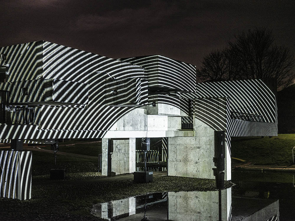 Apollo Pavilion illuminated in striped circular monochrome light