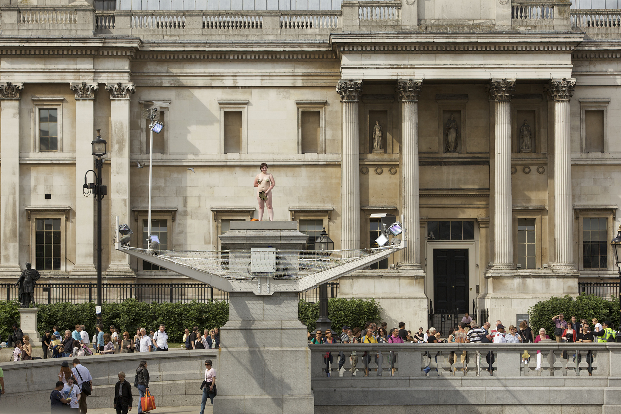 Naked woman standing atop the Fourth Plinth