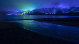 An emerald and blue light roof over the Connemara mountains valley