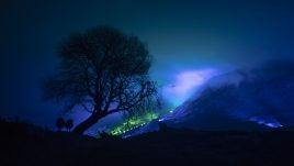 An emerald and blue light roof over the Connemara mountains valley