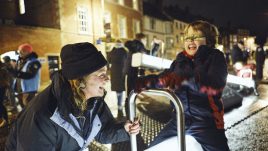 Kate Harvey interacting with illuminated seesaws