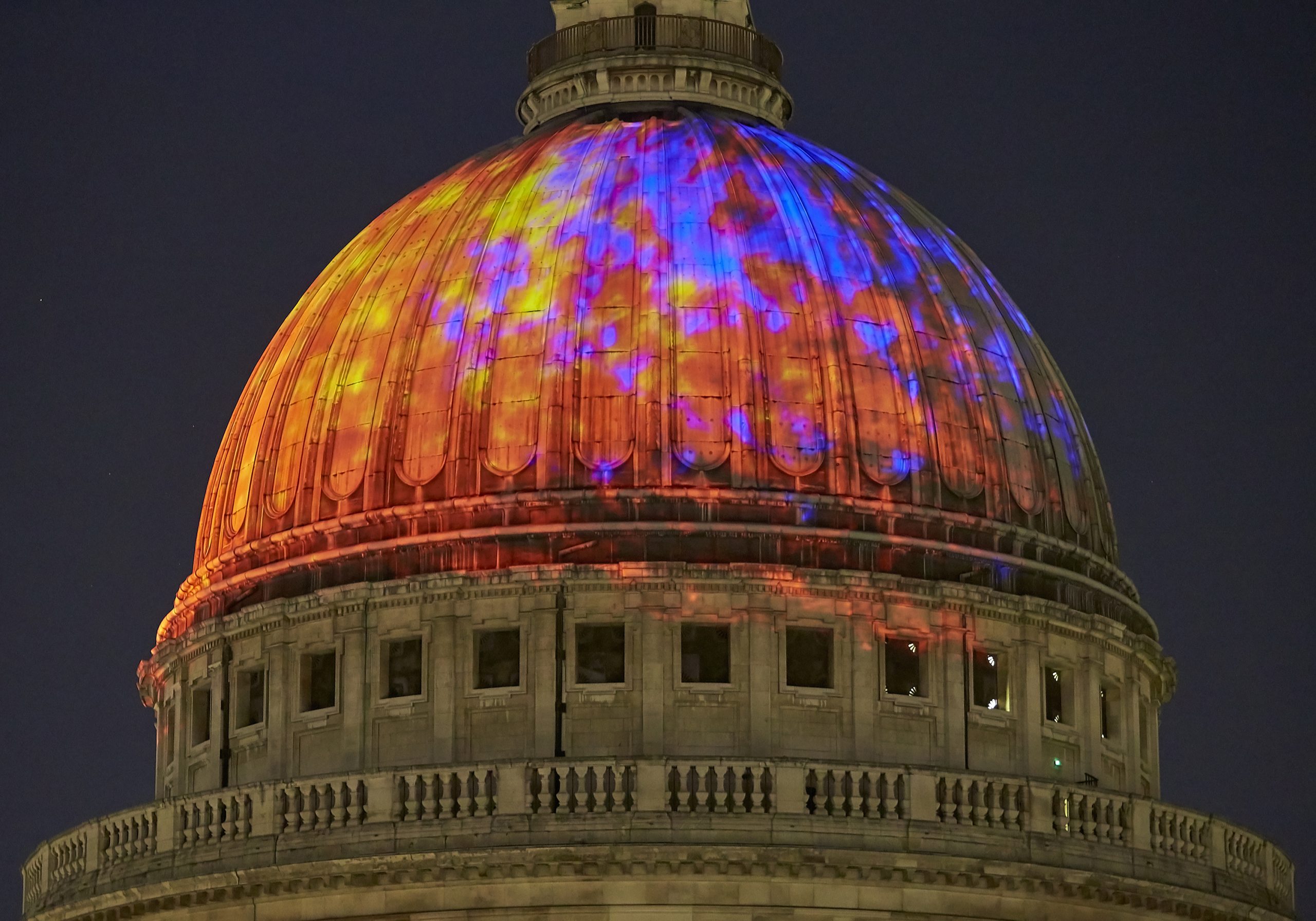 Test projection of Fires of London: orange, yellow and purple squares of light projected onto the dome of St Paul's Cathedral