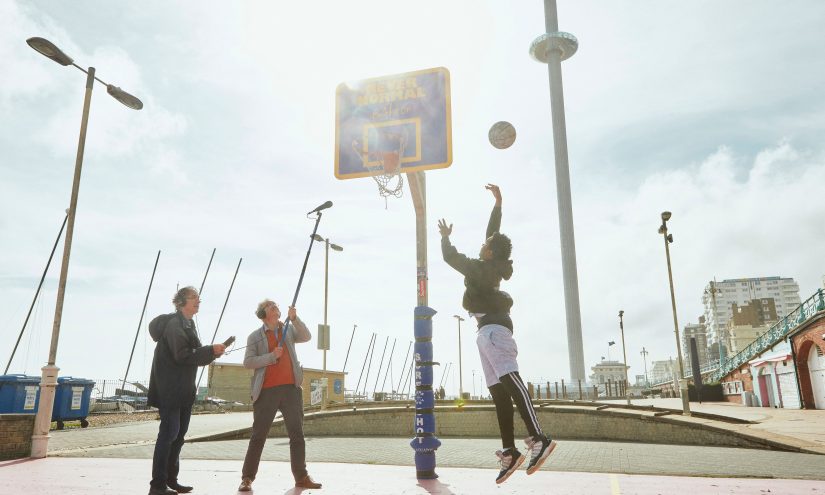 John Del' Nero and assistant recording basketball players on court