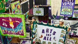 Riggers in the process of installing the Women Making History exhibition