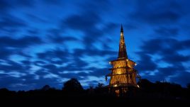 Sanctuary glowing against a darkening blue sky