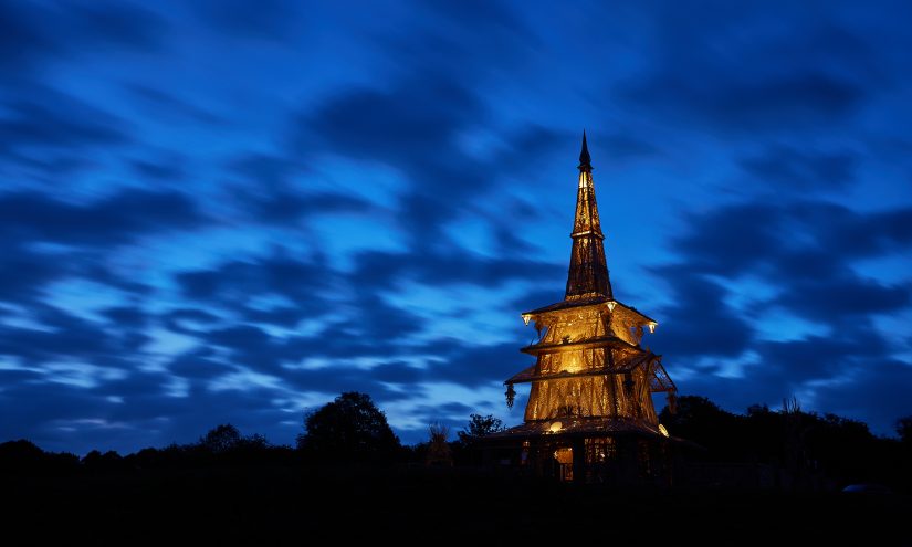 Sanctuary glowing against a darkening blue sky