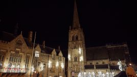 A band of stick men in front of Durham town hall