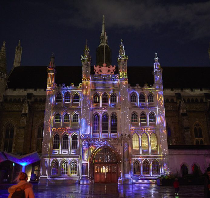 The facade of the Guildhall lit up with a multicoloured installation that is animated based on the music from someone playing the grand piano