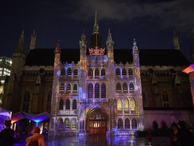 The facade of the Guildhall lit up with a multicoloured installation that is animated based on the music from someone playing the grand piano