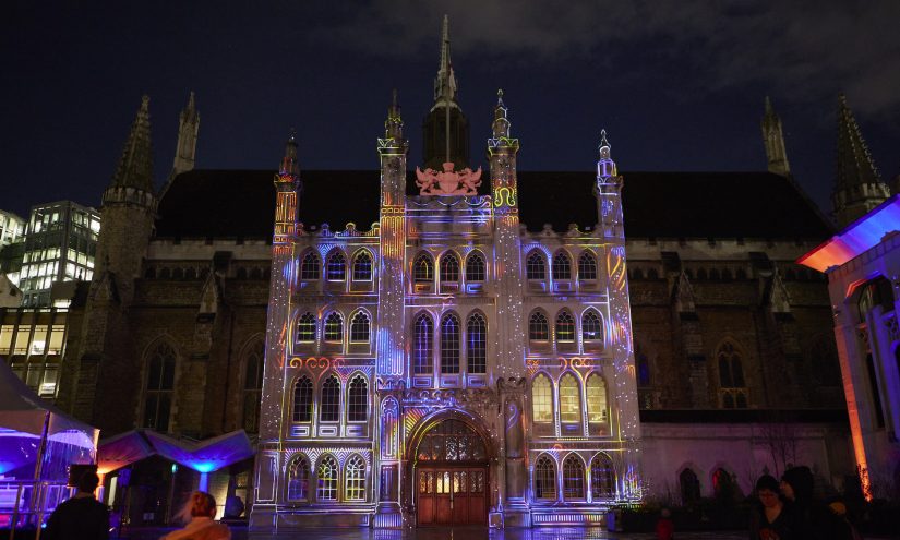 The facade of the Guildhall lit up with a multicoloured installation that is animated based on the music from someone playing the grand piano