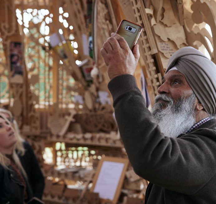 A man taking a photograph inside Sanctuary