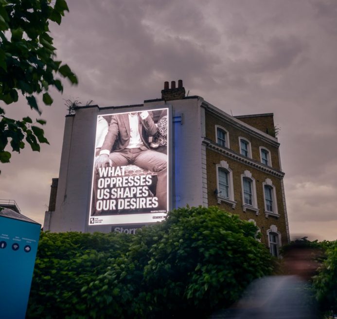 A photo of the billboard launch. The artwork showcased is Martin Firrell's response to the Season 1 theme.