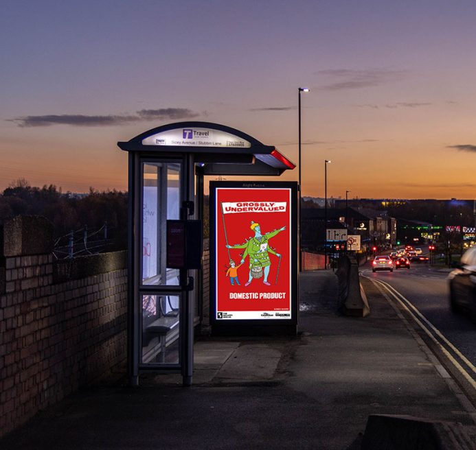 A bus shelter screen showing GROSSLY UNDERVALUED DOMESTIC PRODUCT (2022) by Bobby Baker. A colourful sketched character on a red background. The central figure is adorned with cooking utensils, washing and other domestic symbols. She has several arms; one holds a bulging shopping basket and another arm leans on a walking cane. A child's hand tightly grasps onto another hand and one arm holds a large flag with text across it. The text reads: 'GROSSLY UNDERVALUED DOMESTIC PRODUCT'.