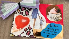 A photo of an artwork created at a workshop with young mothers in Belfast about 'The State We're In'. A collage of magazine clippings. Notable text includes 'Be the beauty you want to see in the world'. Notable images inlude a cupcake, a mother and child walking into the sea and a heart shaped balloon.