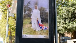 An image of a bus stop digital screen showing the artwork ‘Brit-ish’ (2023) by Azraa Motala.