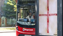 An image of a bus stop digital screen showing the artwork ‘Fragile’ (2023) by op.x.