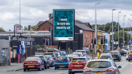 An image of a roadside billboard showing the artwork ‘I Want to Turn my Identity Off’ (2023) by Lori Gordon