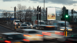 An image of a roadside billboard showing the artwork ‘JUST US!’ (2023) by Amit Sihag.