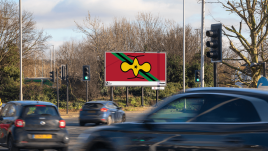 An image of a roadside billboard showing the artwork 