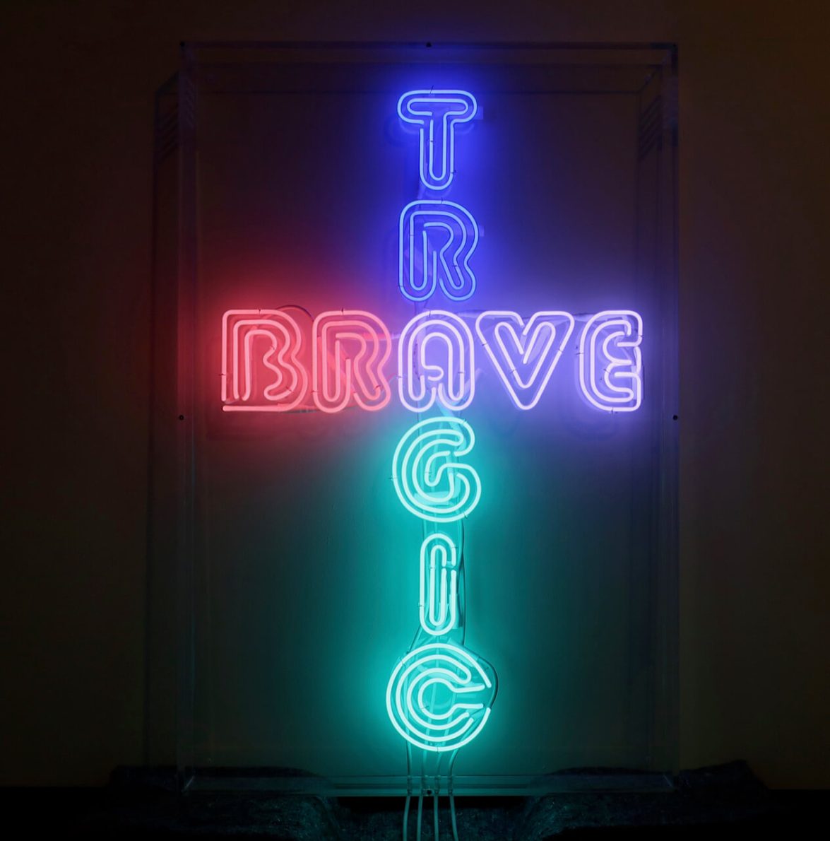 Text reads: ‘TRAGIC/BRAVE’