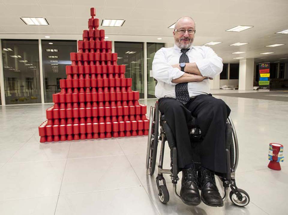 Tony Heaton next to his artwork ‘Shaken Not Stirred’