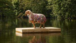 Hant, one of the HERD sheep sculptures, on a floating dock.