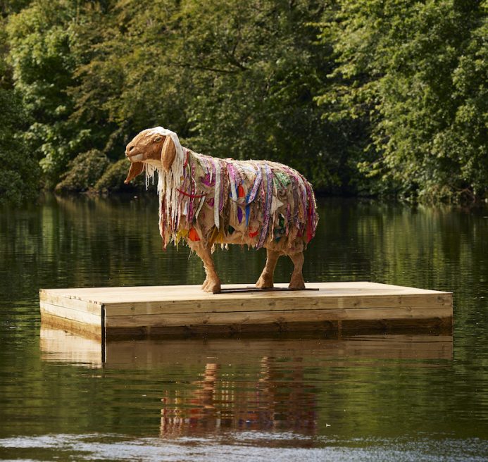 Hant, one of the HERD sheep sculptures, on a floating dock.