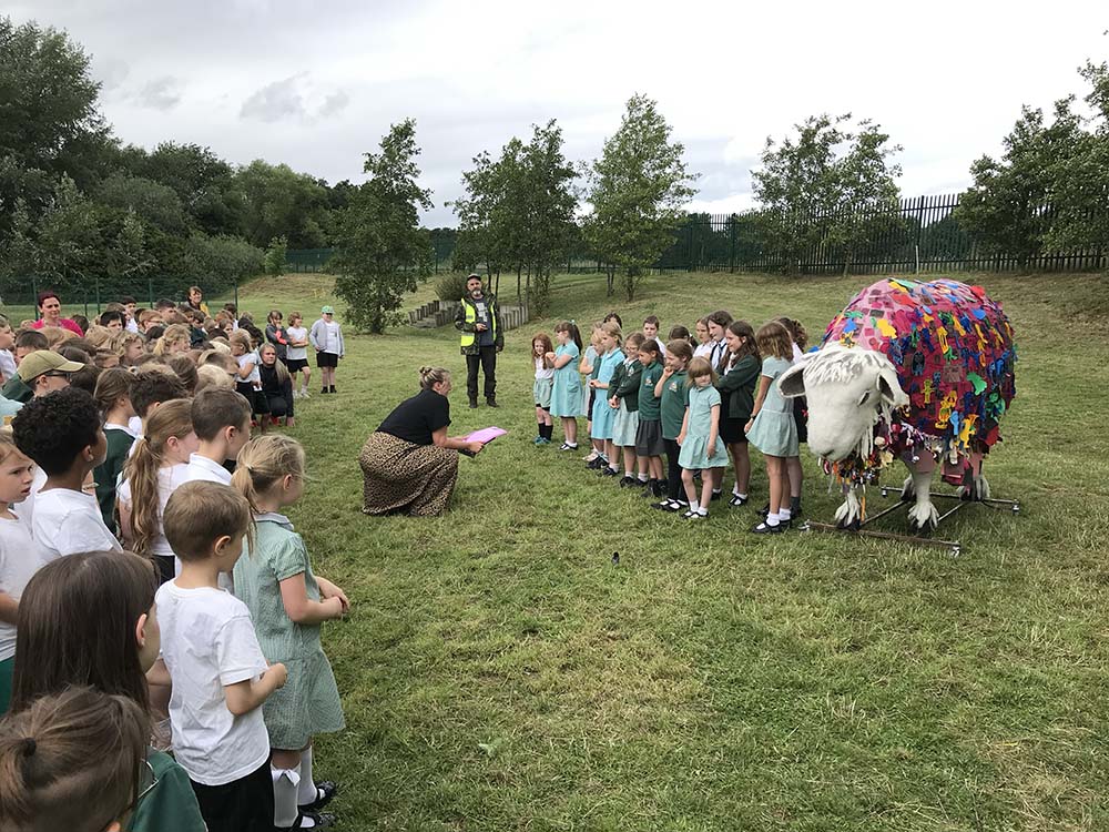School group are introduced to Kindra the sheep