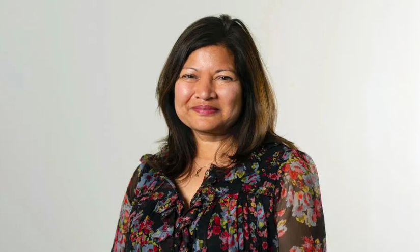 A photograph of Shirley Rodrigues wearing a flowery shirt
