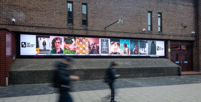All artworks from ‘A Real Woman’ lined up on a digital billboard in Waterloo. The Gallery, Season 4, 2024. Produced by Artichoke. Image from the launch event, 10 July 2024. Photo by Yves Salmon